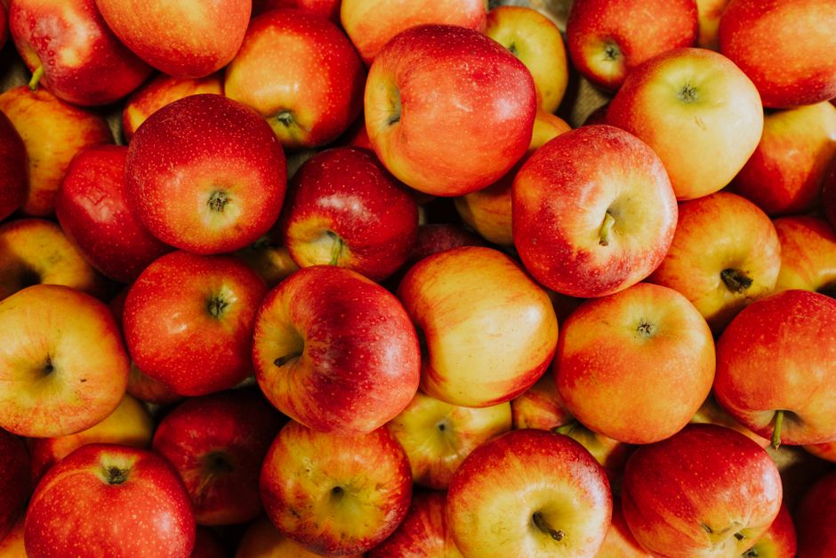 Freshly harvested red apples with a lush and natural appeal, perfect for seasonal advertising.